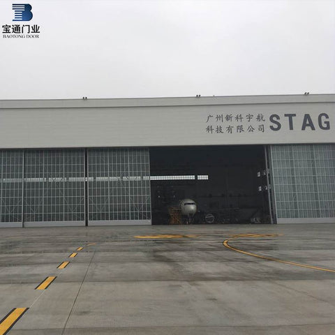 Low price industrial bi-parting sliding hangar folding door system on China WDMA