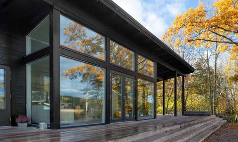 Super insulated Black-painted aluminium window frames surround the large triple-glazed windows. on China WDMA